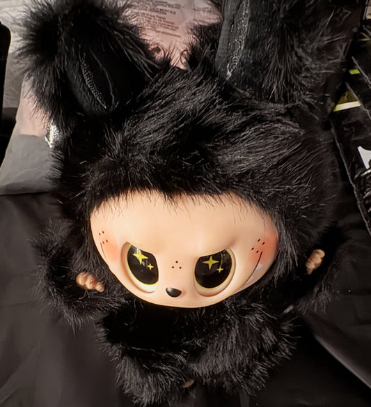 The Monsters black and plush with wings